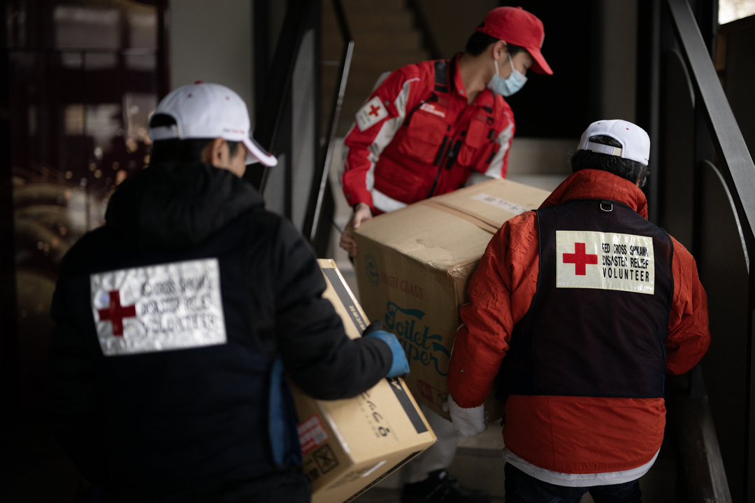 240109_Wajima Roadside Station_Two Red Cross volunteers in the back and Osaka Branch Rescue Team (Osaka Red Cross Hospital).jpg